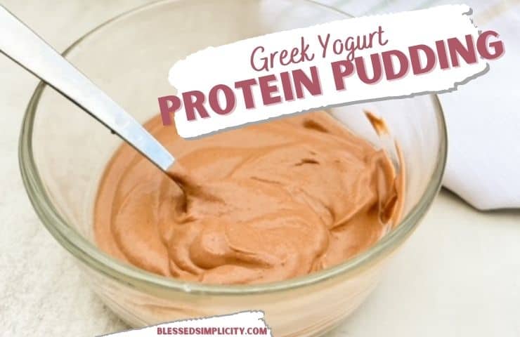 greek yogurt protein pudding in a clear glass bowl with a metal spoon.